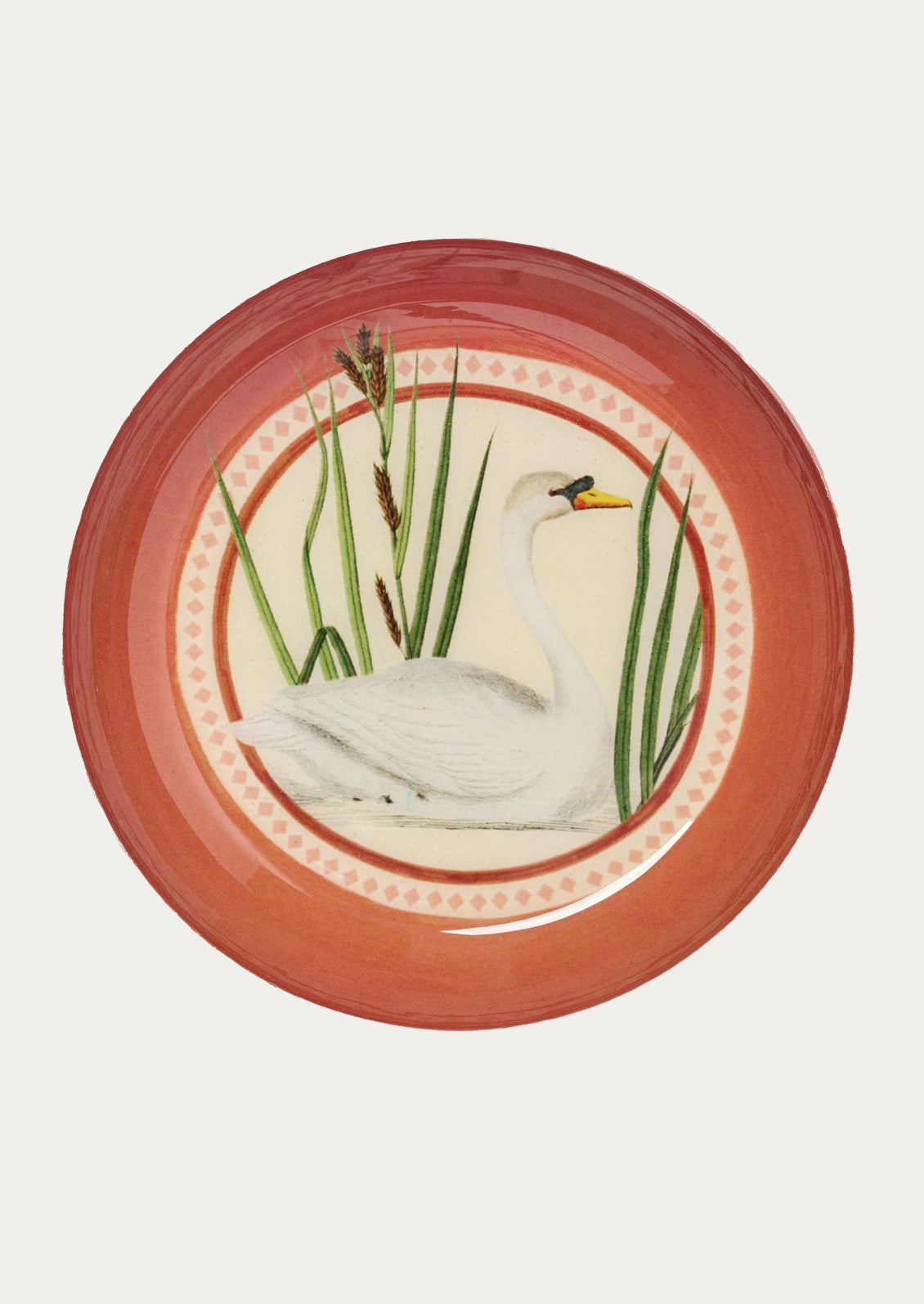 Decorative round tray with a swan design on a white background