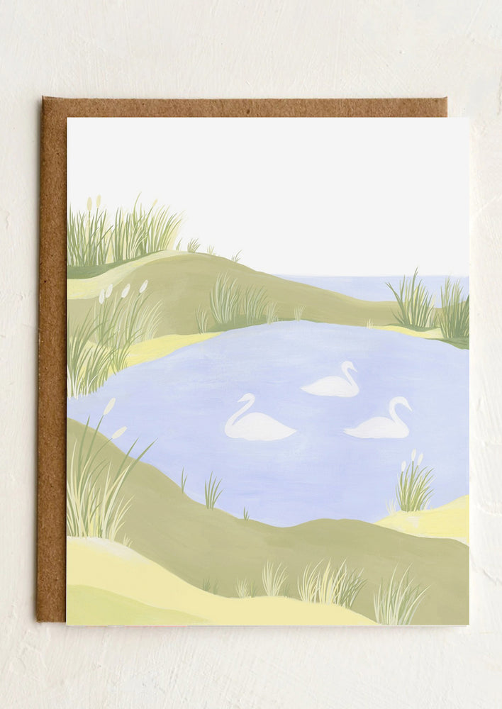 A blank illustrated greeting card with images of swans on lake.