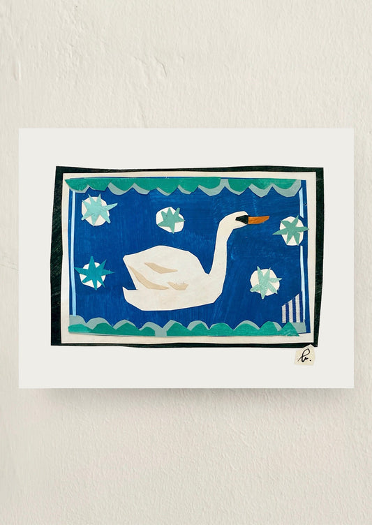 A print of an original collage of a swan on water.