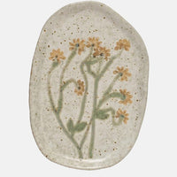 Wide Yellow Flower: Ceramic plates in asymmetrical shapes with wildflower patterns.