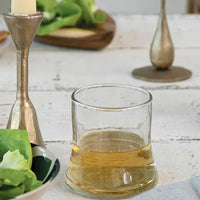 2: A tapered drinking glass on a table.