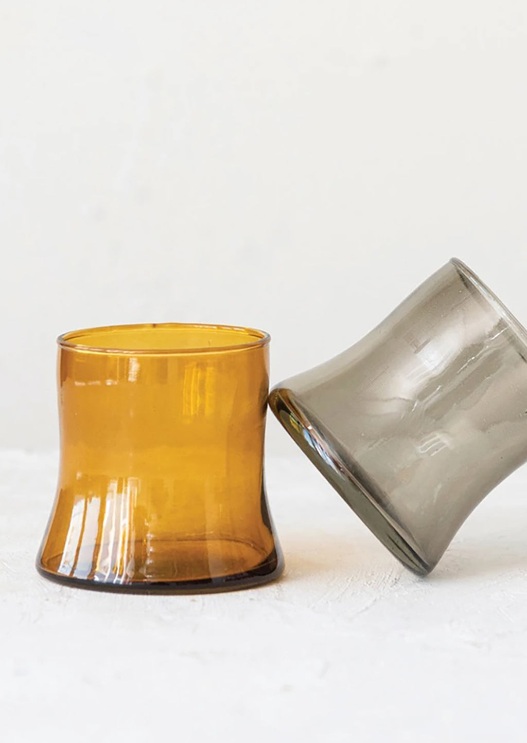 Smoke / 10 oz: Two tapered drinking glasses in amber and smoke.