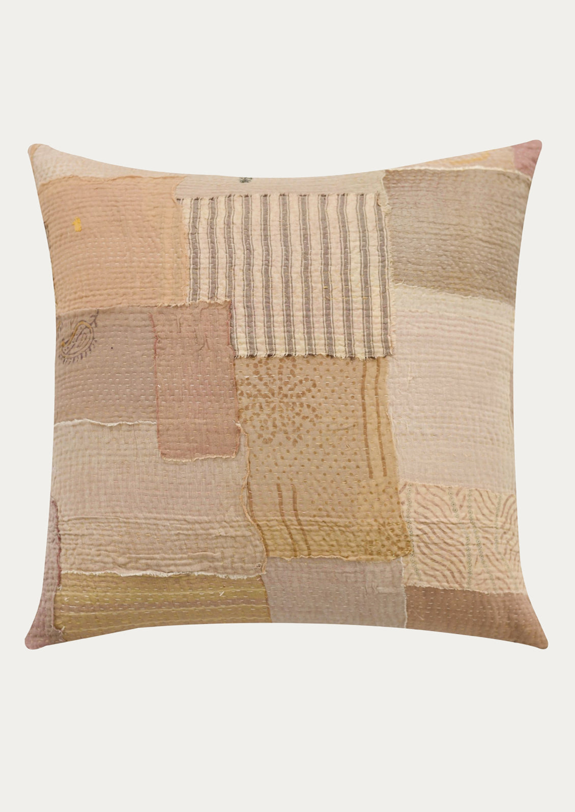 Patchwork pillow with textured patterns in earthy tones on a white background