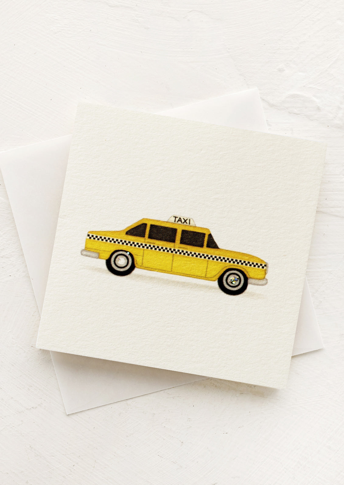 A small gift enclosure card with yellow cab design.