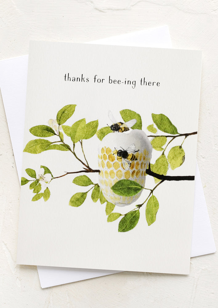 A greeting card with an illustration of a beehive, text reads "Thanks for bee-ing there".