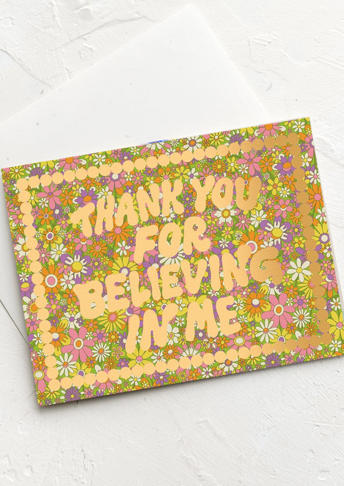 A floral print card reading Thank you for believing in me.