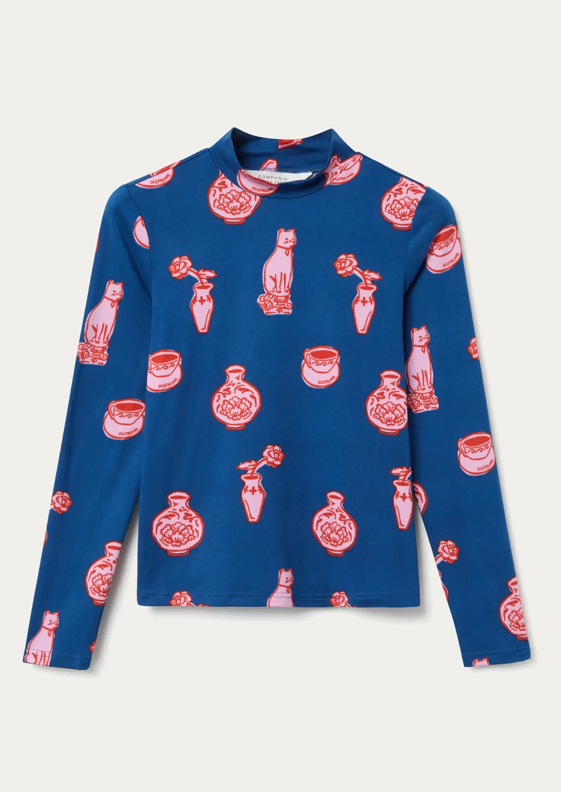 Blue long-sleeve shirt with red and pink ceramics pattern.