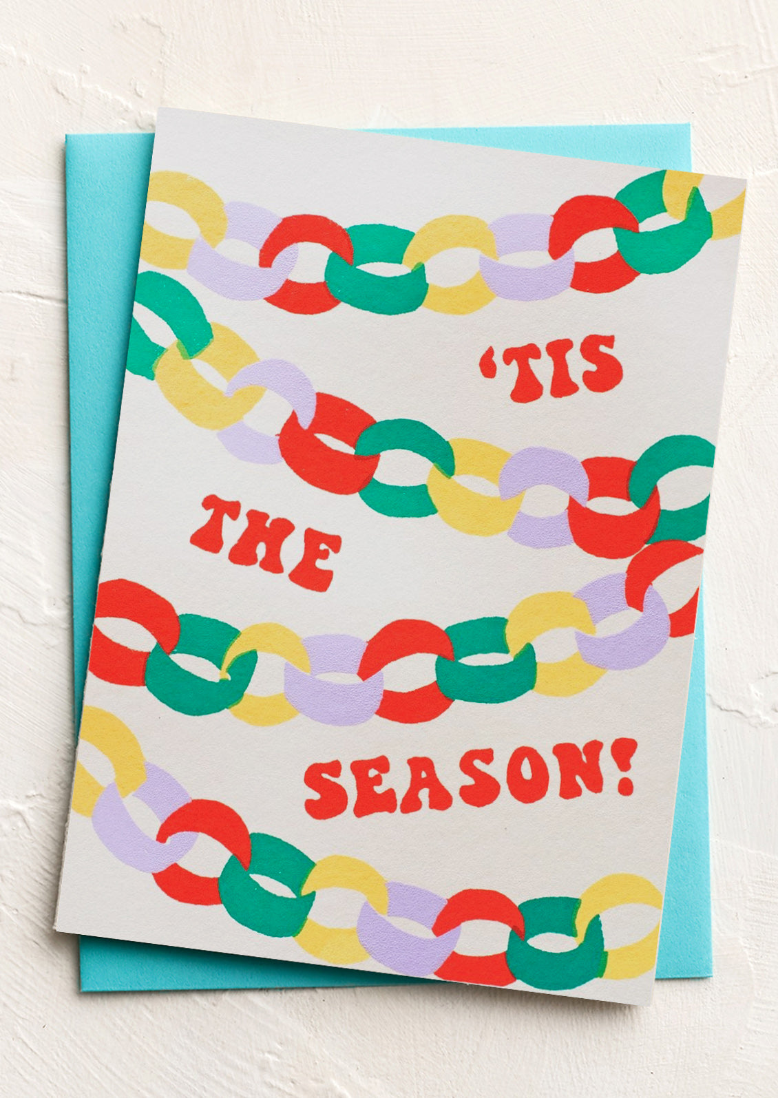Greeting card with colorful chain pattern and 'Tis the Season text on a white background
