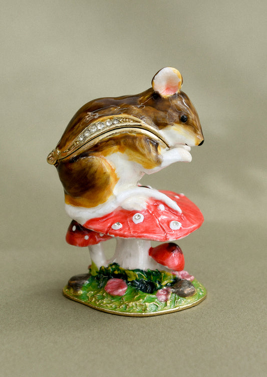 A crystal detailed metal trinket box depicting a wood mouse sitting on top of a red toadstool.