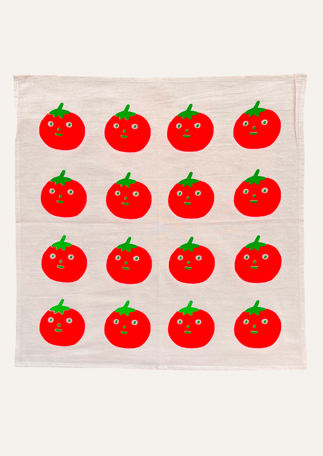 A tea towel with repeating anthropomorphic tomato motif.