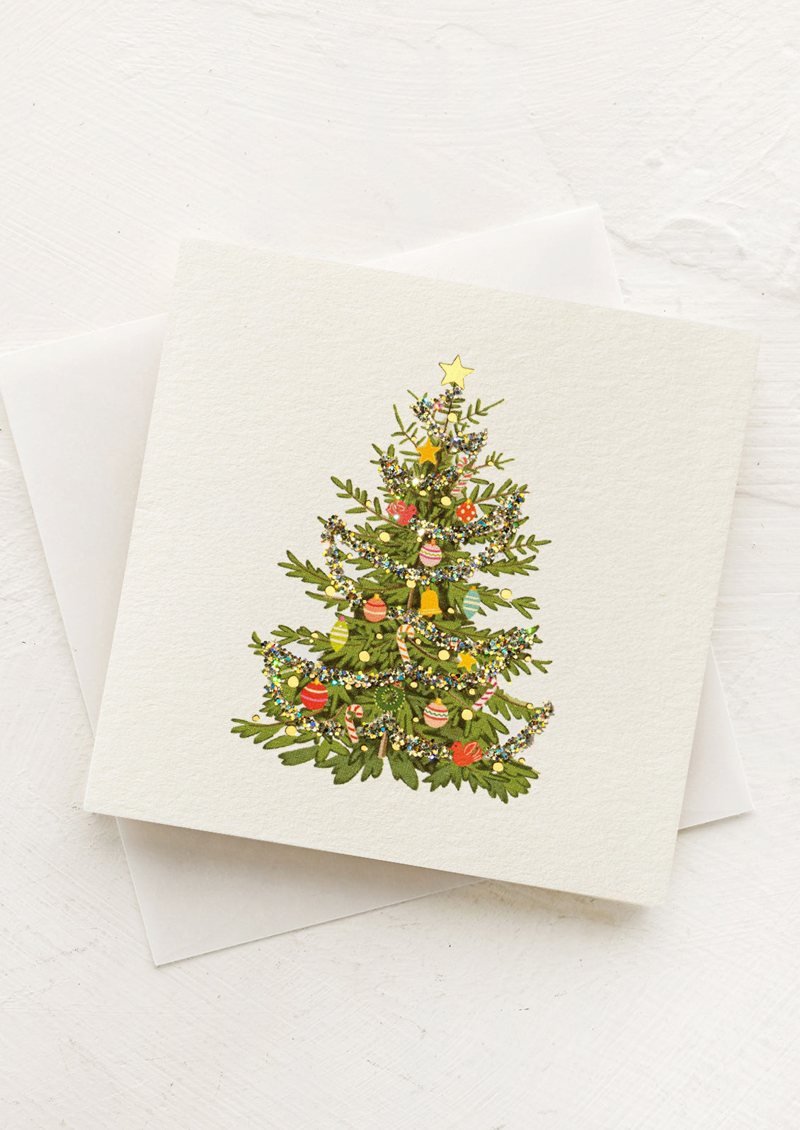 Greeting card with a Christmas tree design on a white background