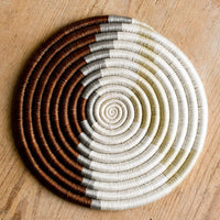 1: A woven sweetgrass trivet with geometric pattern in brown, grey, white and tan.