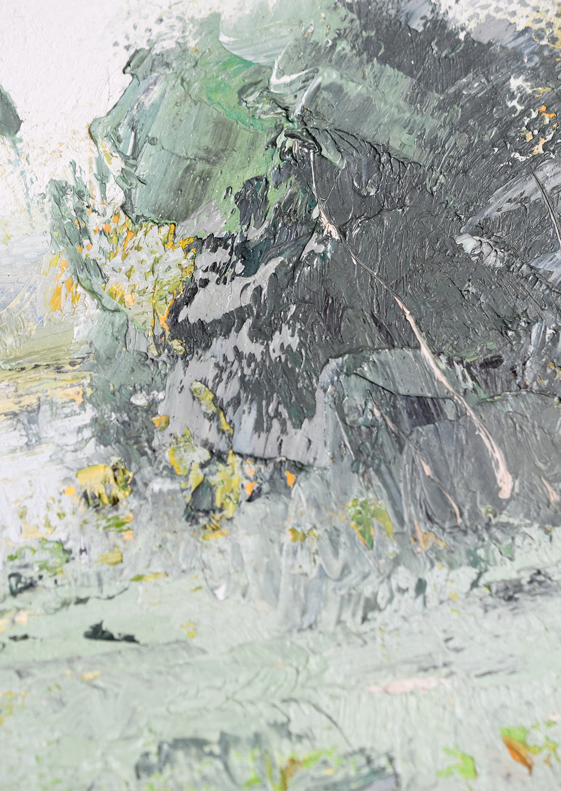 A framed original painting of a cool-colored lakeside landscape setting.