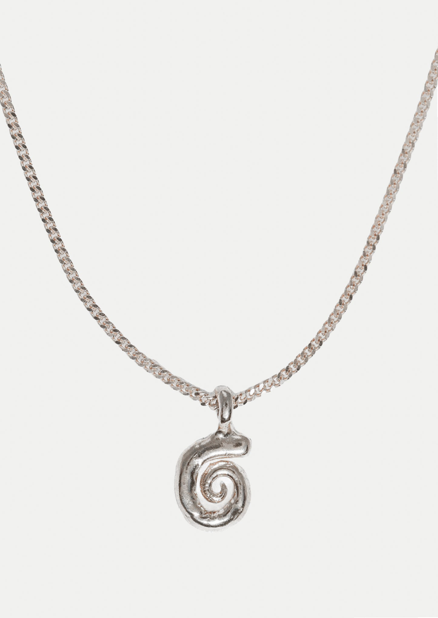 Silver necklace with a spiral pendant on a white background