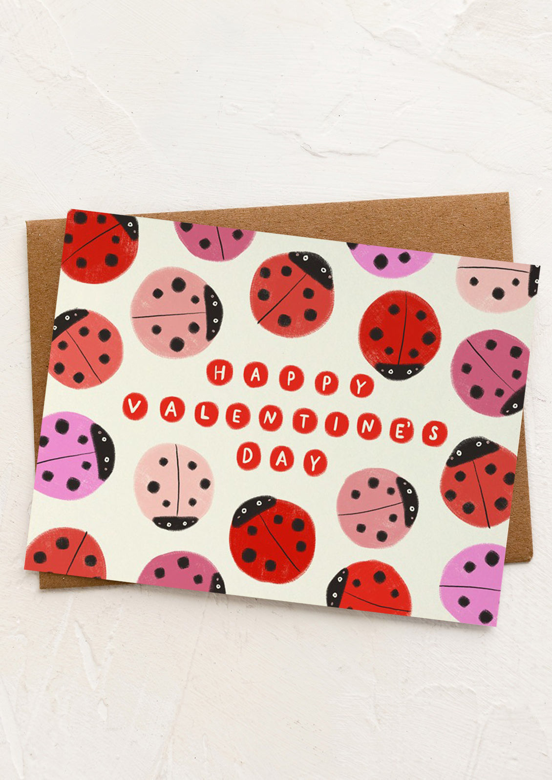 Valentine's Day card with ladybug pattern and 'Happy Valentine's Day' text on a white background.