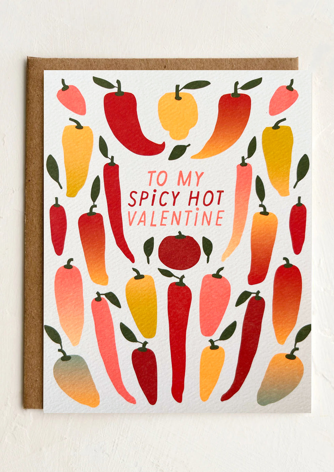 Greeting card with colorful chili pepper design and text 'To my Spicy Hot Valentine' on a white background.