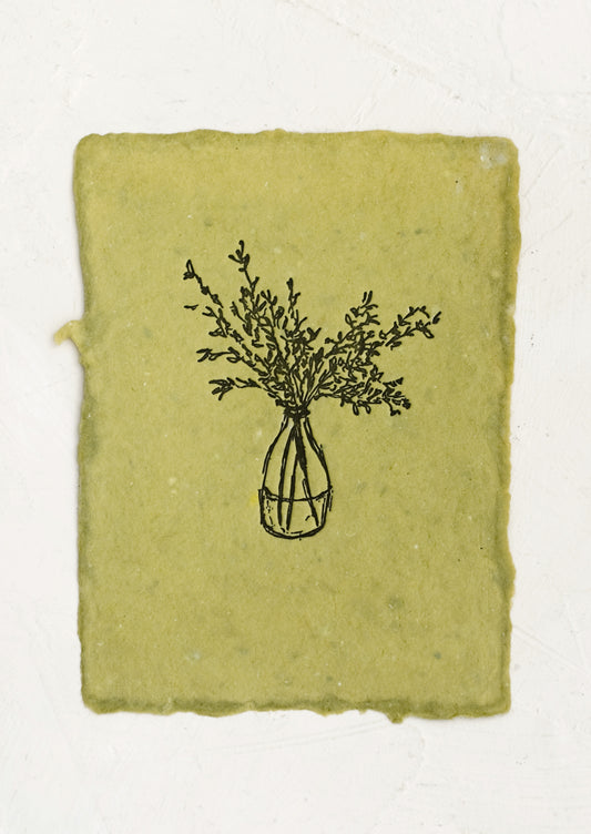 A naturally dyed art print on green paper with letterpressed image of branches in vase.
