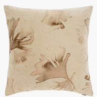 1: An ivory velvet throw pillow with brown eco natural leaf print.