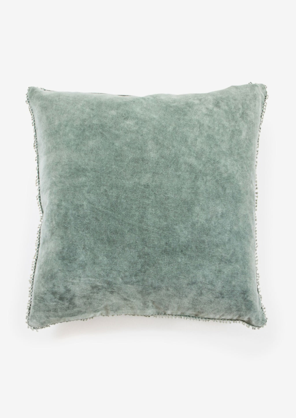 Juniper: A velvet throw pillow with pom pom trim in juniper color.