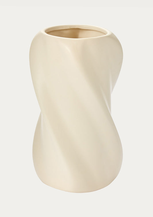 Beige ceramic vase on a light beige background