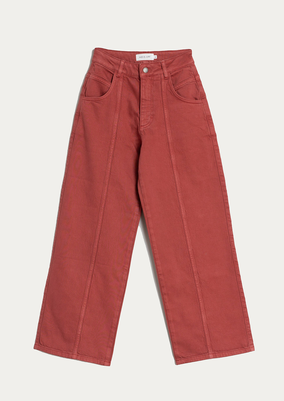 A pair of red wide leg jeans with vertical seam down front.