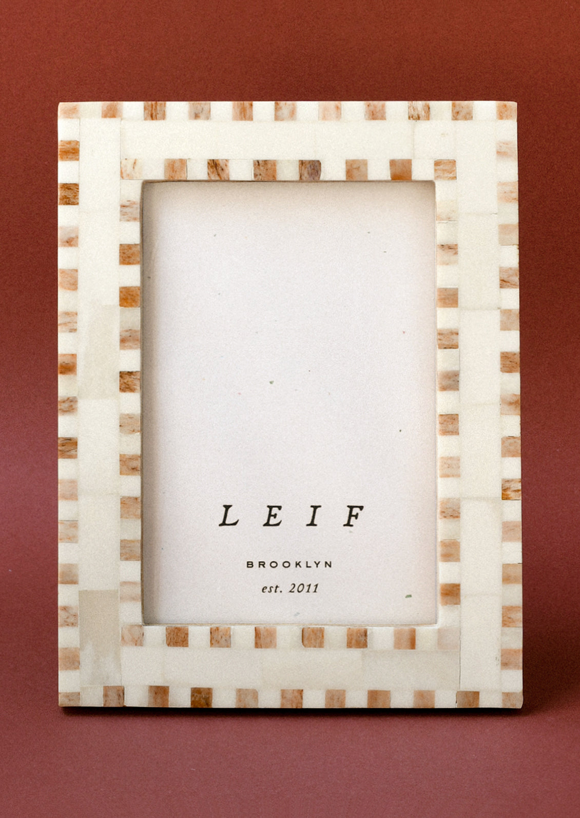 A 4" x 6" picture frame with a checkered design.
