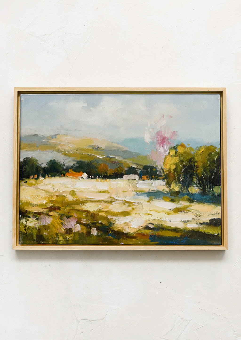 1: A framed original painting of colorful meadow/vista.