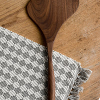 Wide: A walnut wood spatula in wide shape.
