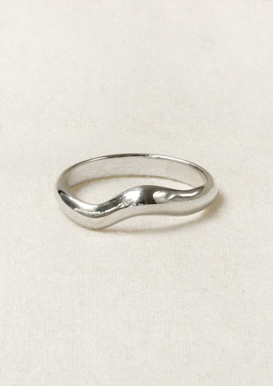 A sterling silver ring with a wavy design.