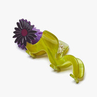 3: A wavy green hair claw with purple flower.