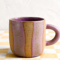 Lavender Speckle: A ceramic mug with wavy stripe pattern in lavender.