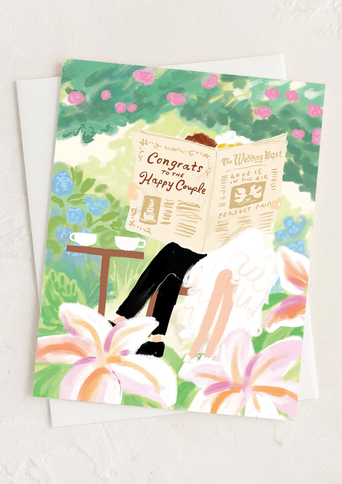 Greeting card with a couple reading a newspaper in a garden setting
