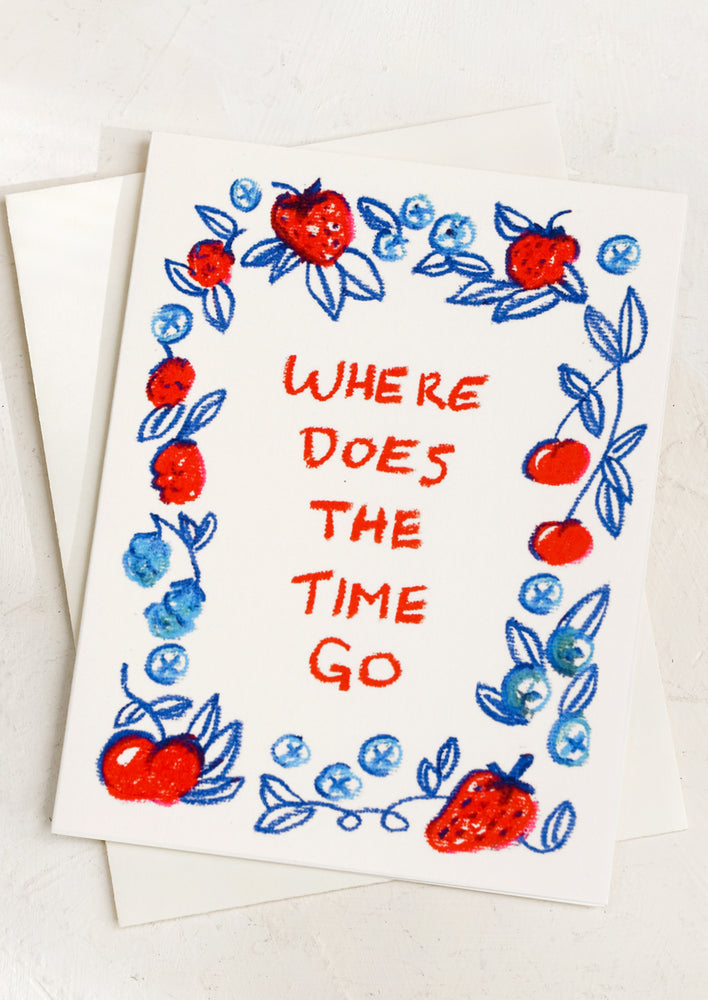 A card with strawberry print reading "where does the time go"?