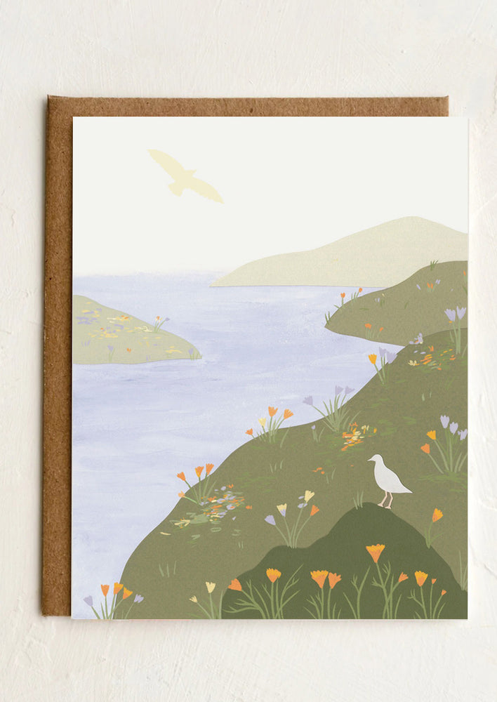 A blank greeting card with illustration of wildflower cliffs.