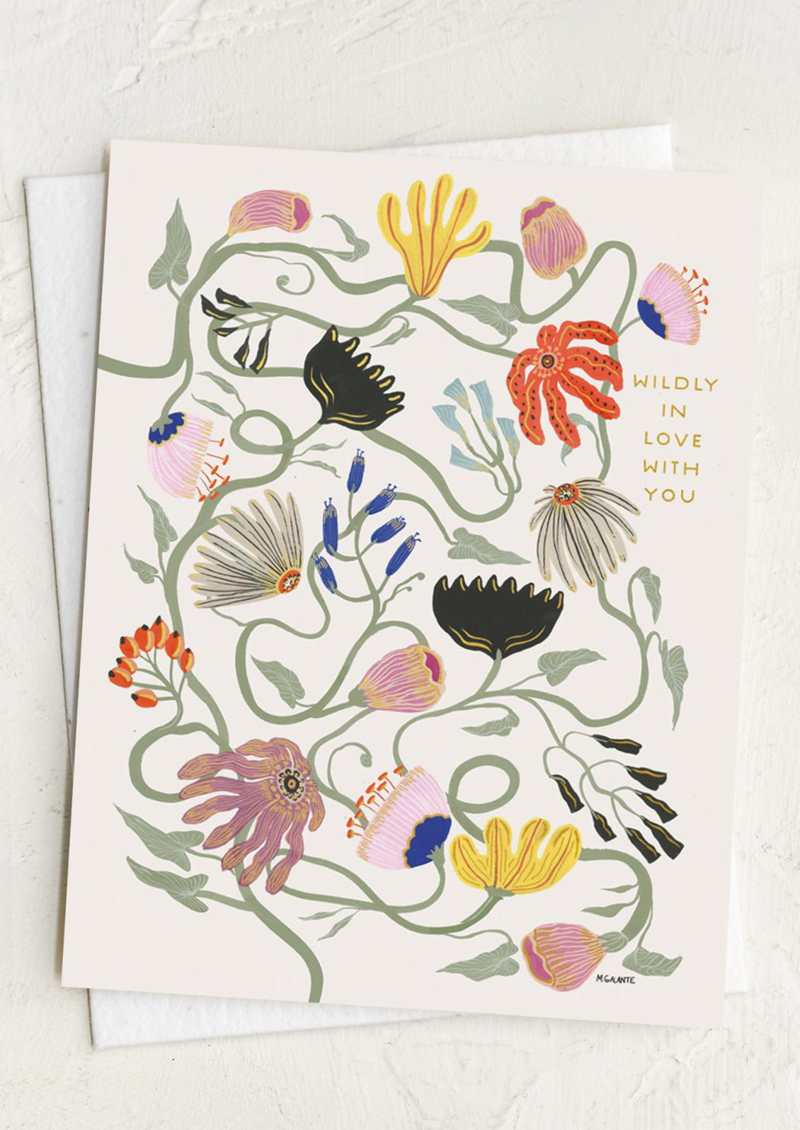 Greeting card with floral design and text on a white background reading "Wildly in love with you".