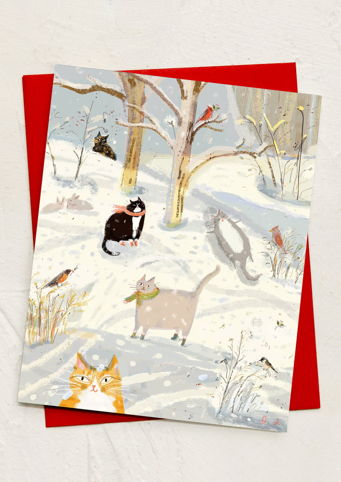 An illustrated greeting card of cats in the snow.