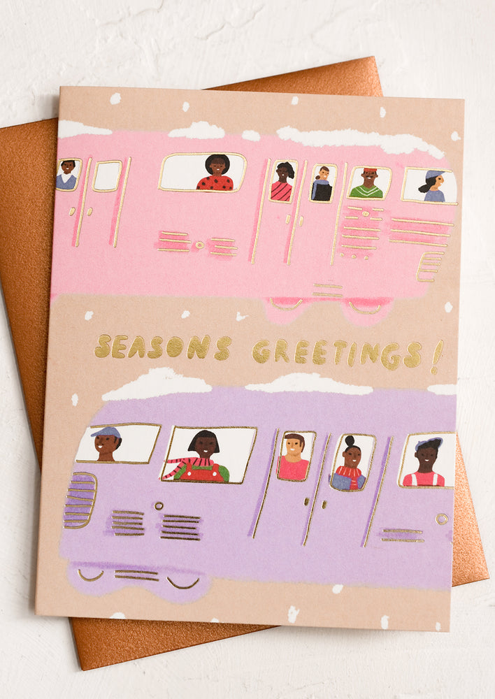 A card reading "Season's Greetings!" with illustration of people on a train.