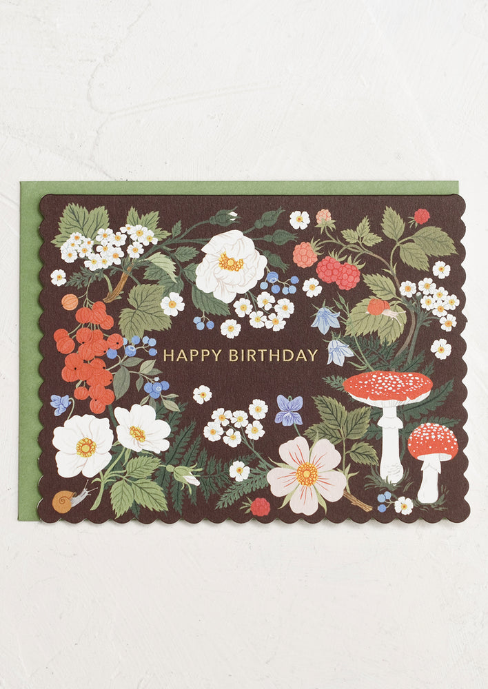 A scalloped birthday card with woodland print.