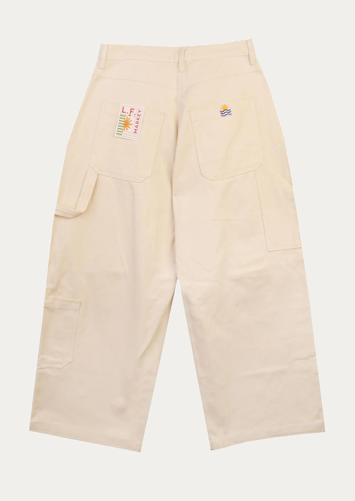 A pair of workwear-inspired pants in ecru color.