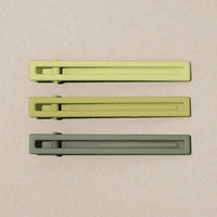 Lime Multi: A set of three bar-shaped hair clip sets in shades of green.