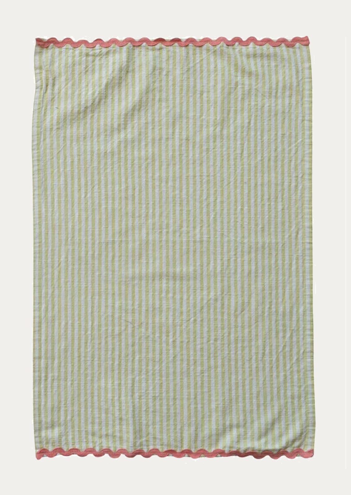 A yellow and white striped tea towel with pink ric rac trim at top and bottom.