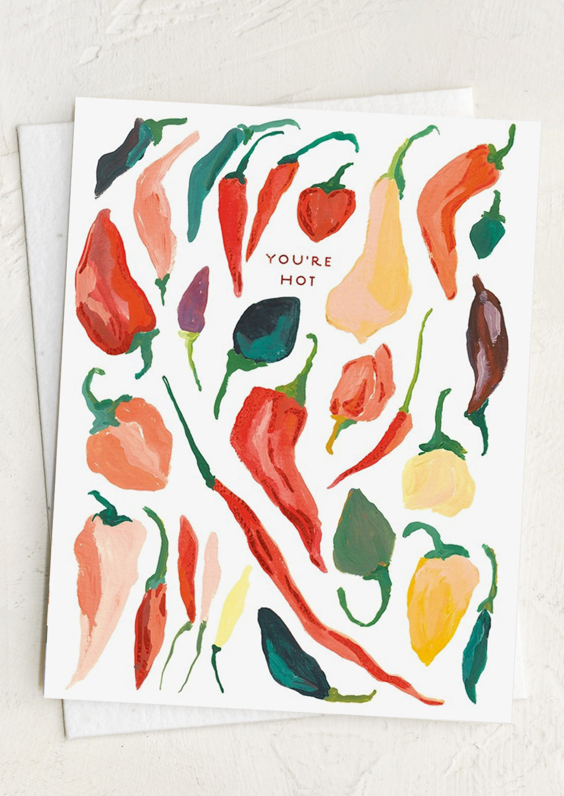 Card with colorful chili pepper pattern and 'You're Hot' text on a white background