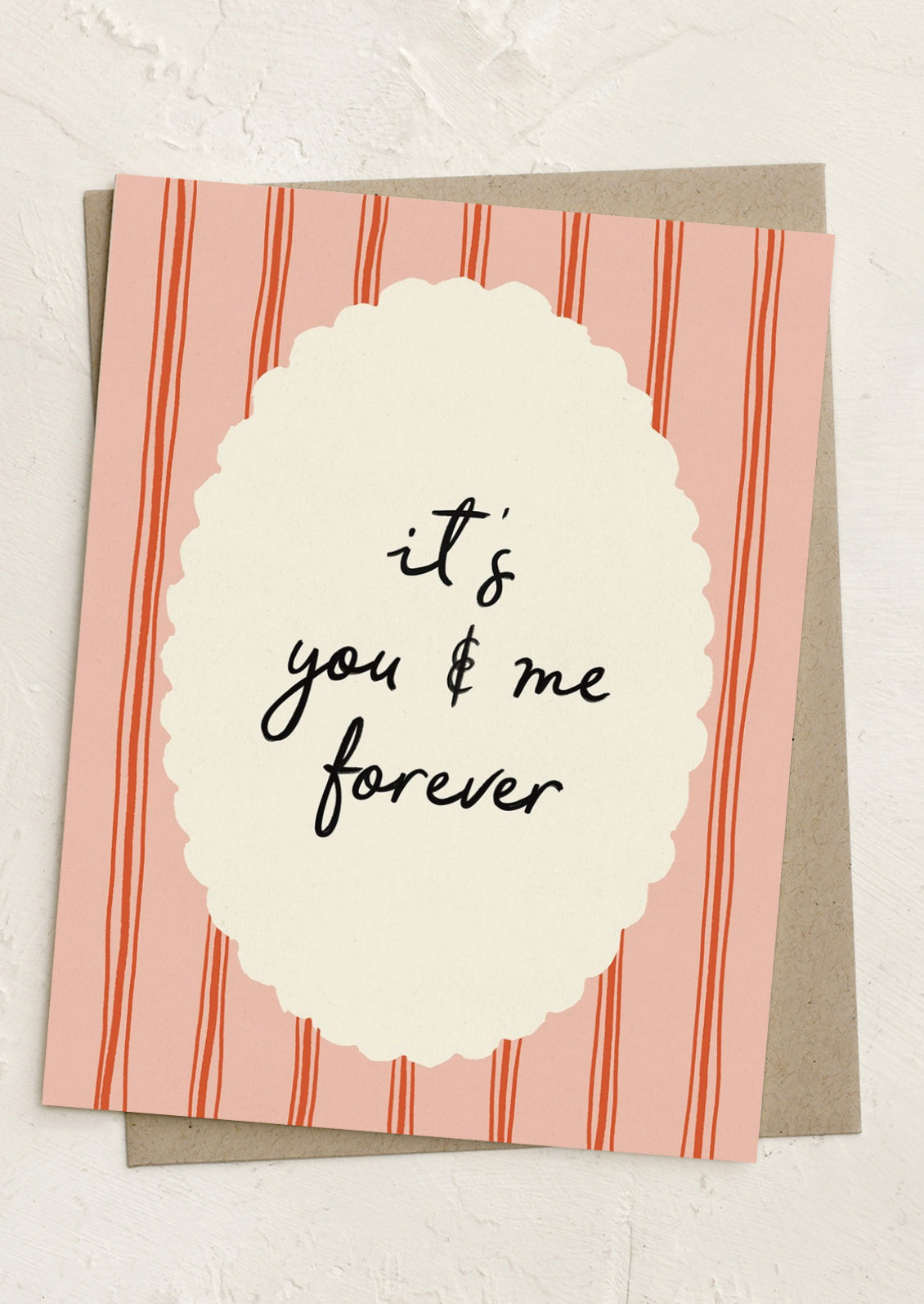 A greeting card with framed text reading "It's you and me forever".