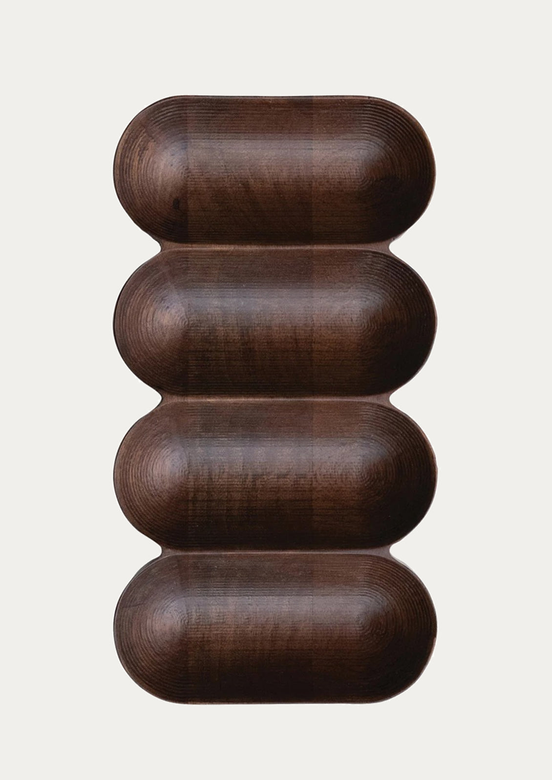 A dark wood serving vessel with four sections.