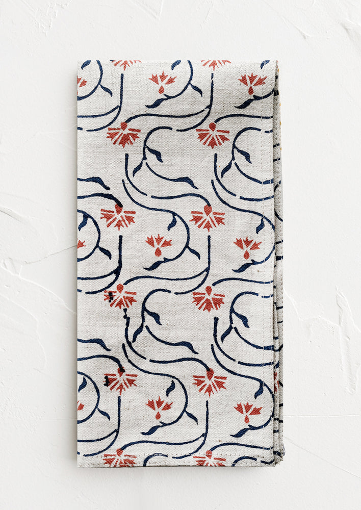 2: A block printed linen napkin with floral line print.