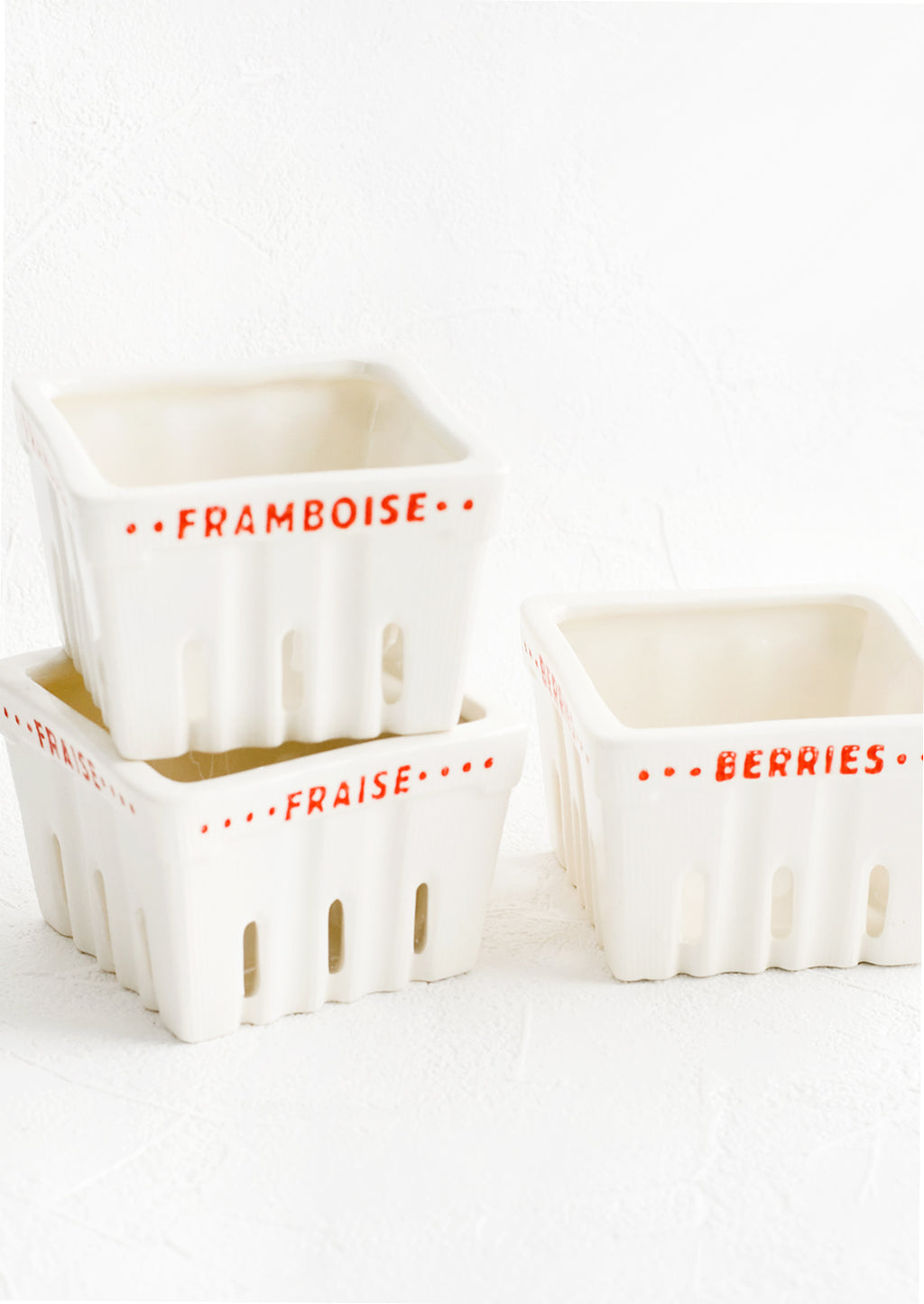2: Ceramic berry baskets made to look like the disposable variety, but in white ceramic with red letters in French.