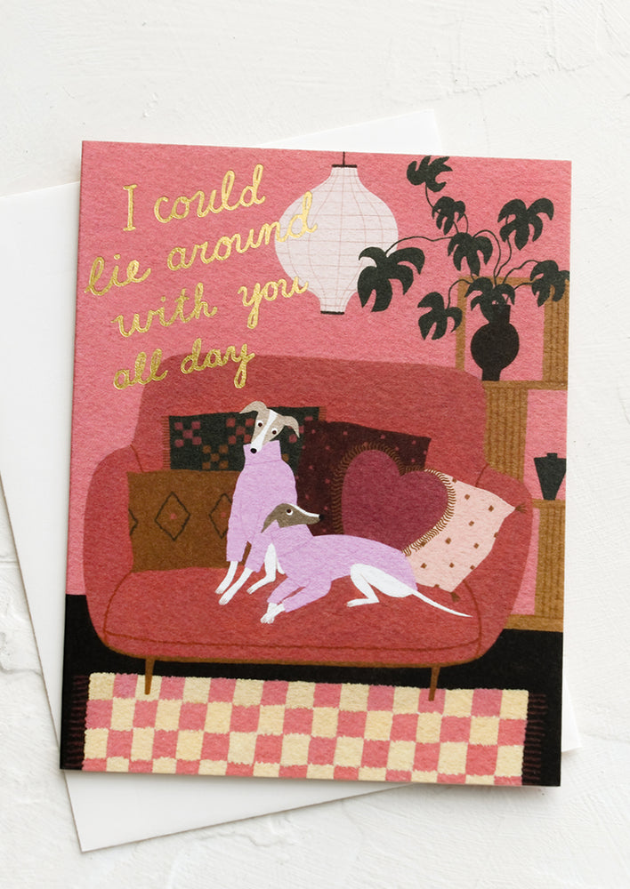 An illustrated greeting card with greyhounds on a couch.