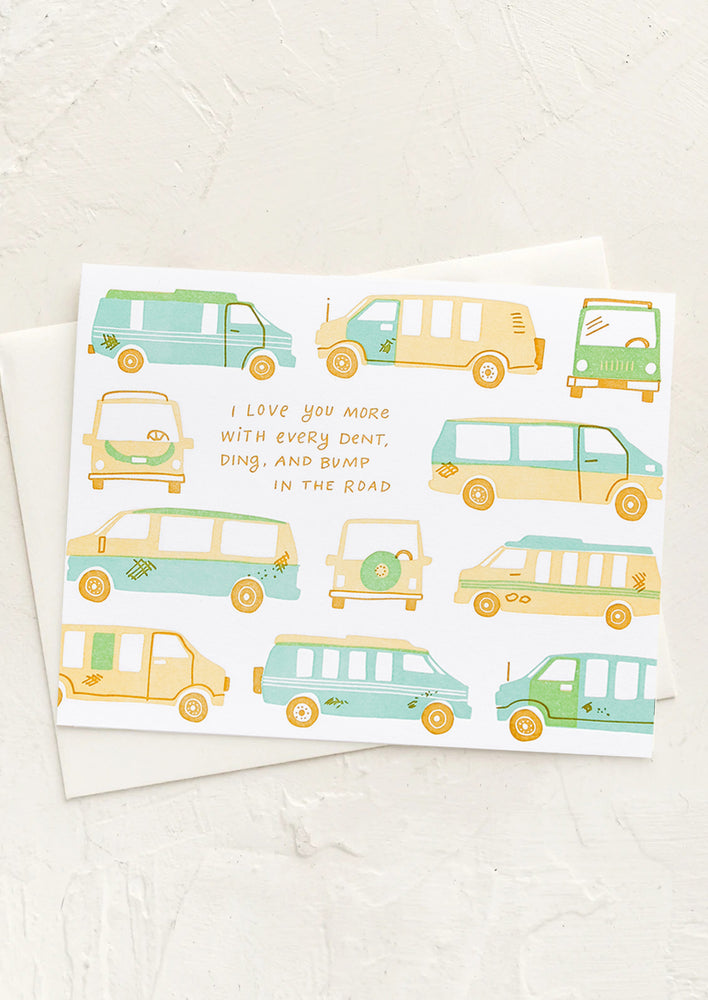 A card with cars print and text reading "I love you more with every dent, ding and bump in the road".