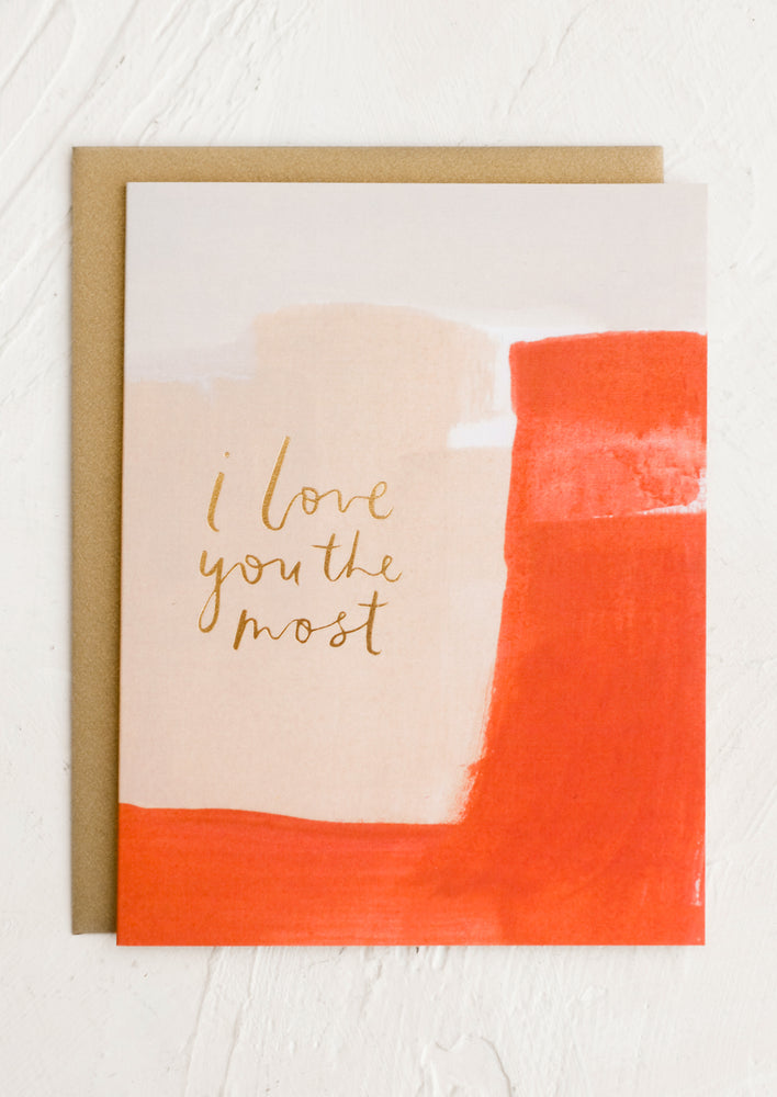 A card with red and pink watercolor design, gold script reads "I love you the most".
