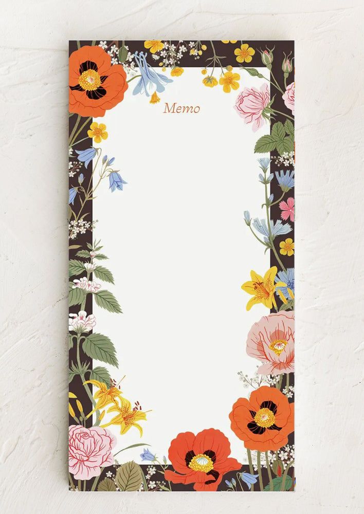 A notepad with dark floral border and "Memo" printed at top.